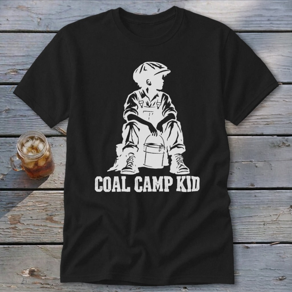 Black t-shirt with white graphic of a boy in overalls and cap, holding a bucket, with text "COAL CAMP KID".