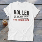 White t-shirt with "HOLER NOT JUST WHERE YOU LIVE BUT HOW YOU CALL SOMEONE FIVE RIDGES OVER" text.