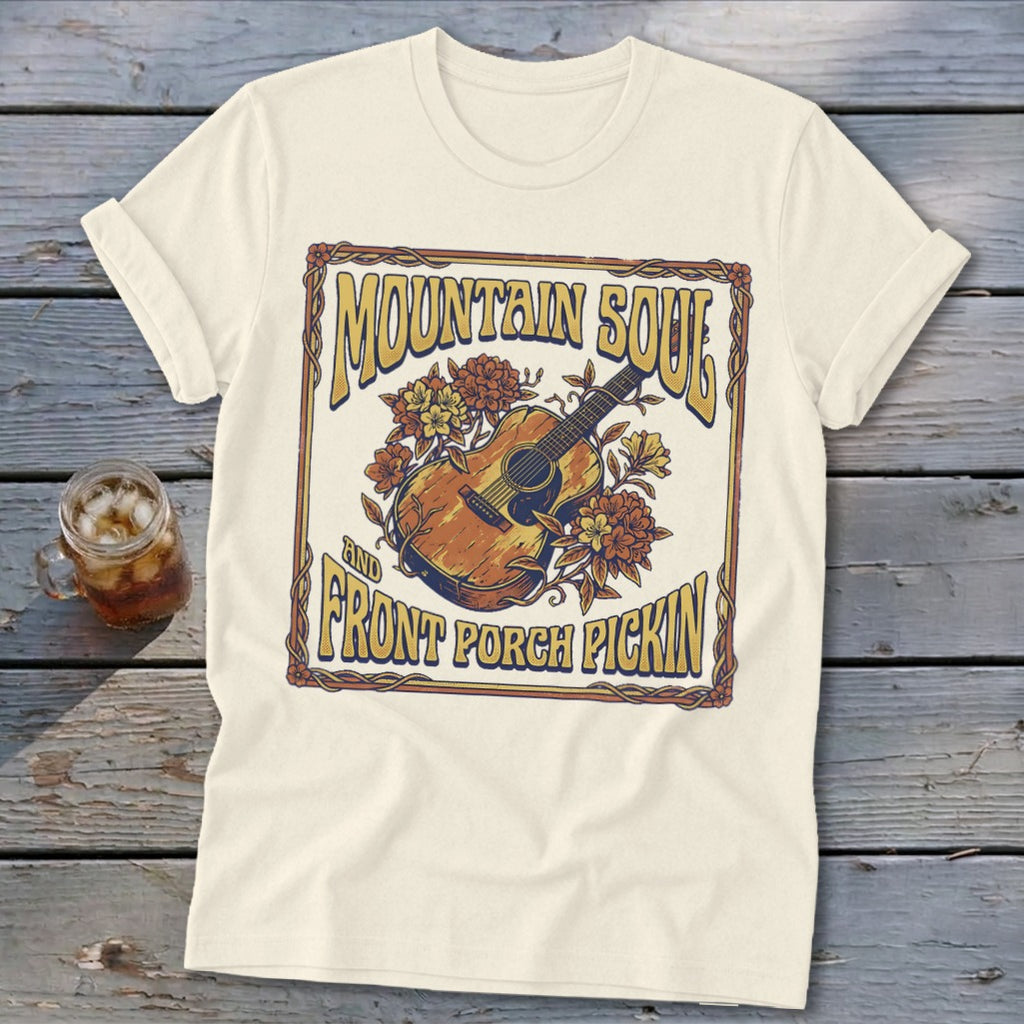 Cream t-shirt with "Mountain Soul and Front Porch Pickin'" text and guitar graphic.