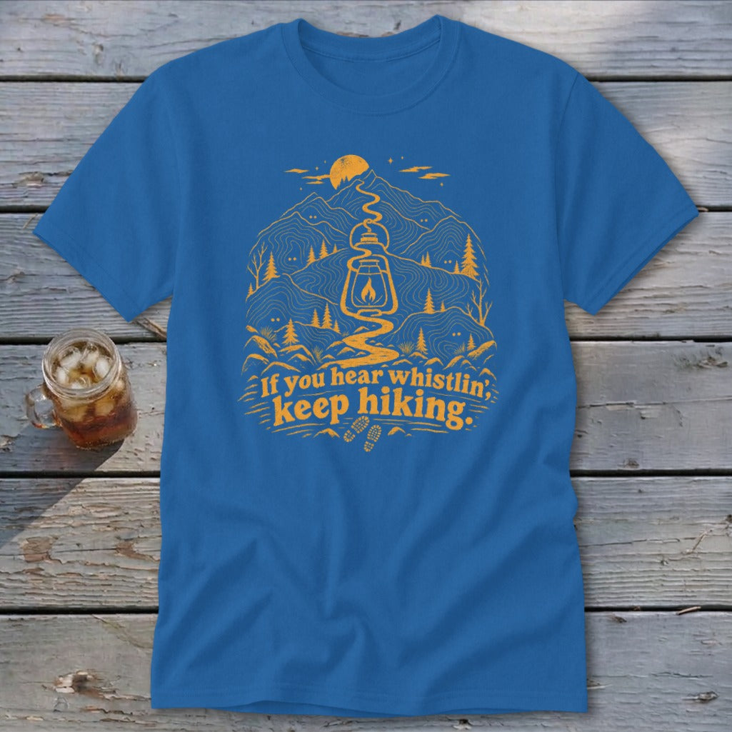 Blue t-shirt with orange mountain graphic and "If you hear whistlin', keep hiking." text.