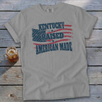 Gray t-shirt with "Kentucky Raised American Made" and distressed American flag design.