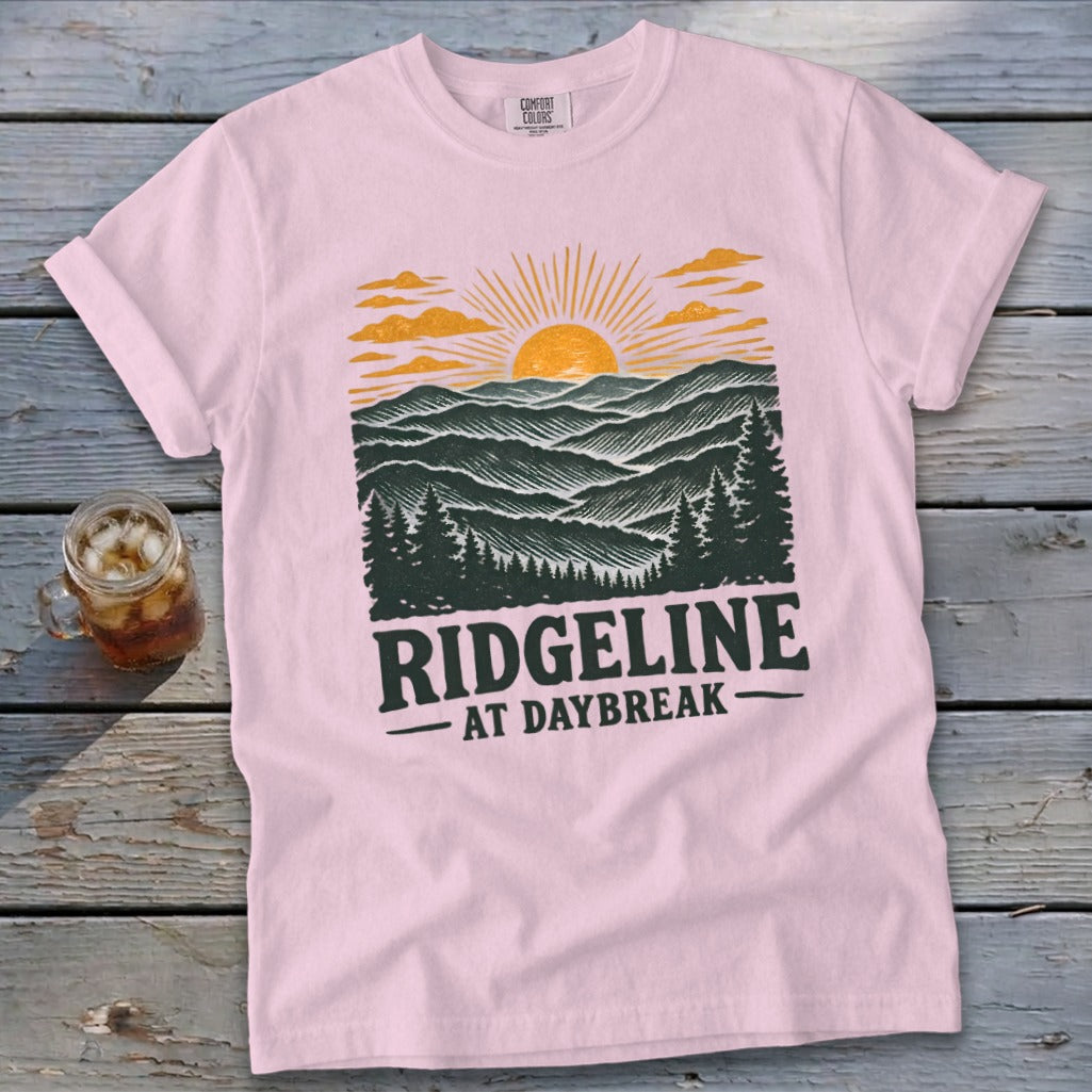Pink t-shirt with "RIDGELINE AT DAYBREAK" text and a mountain landscape graphic.