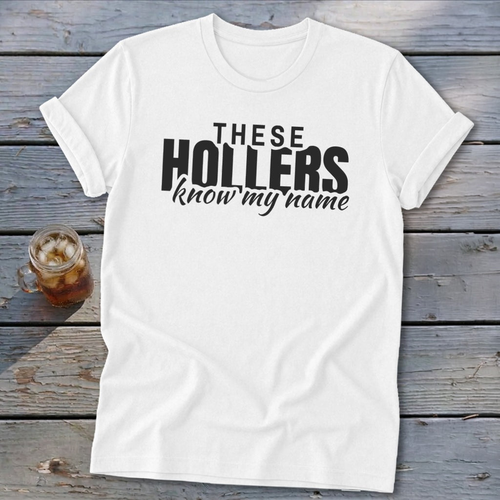 White t-shirt with black text that reads "THESE HOLLERS know my name".