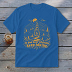 Blue t-shirt with orange mountain graphic, lantern, and text "If you hear whistlin', keep hiking."
