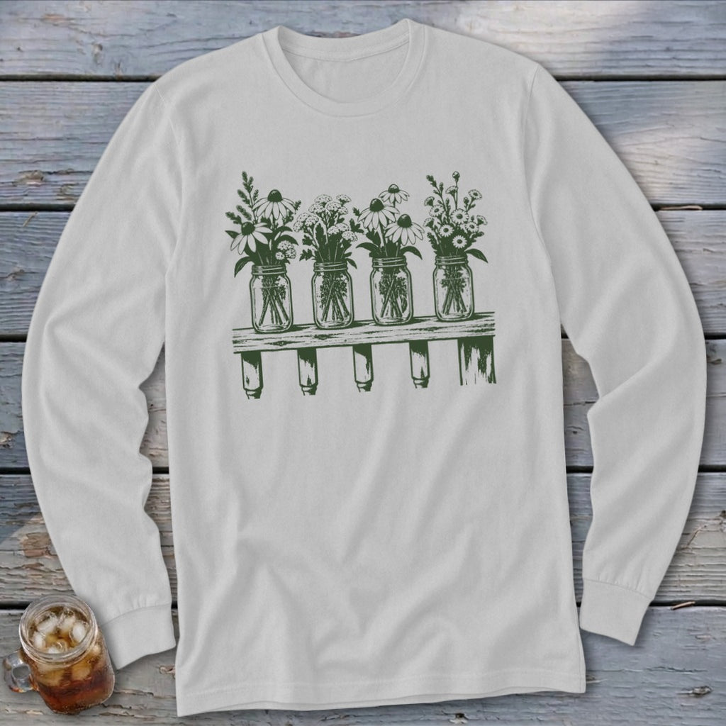 Light gray long-sleeve t-shirt with a green graphic of four mason jars filled with wildflowers on a shelf.