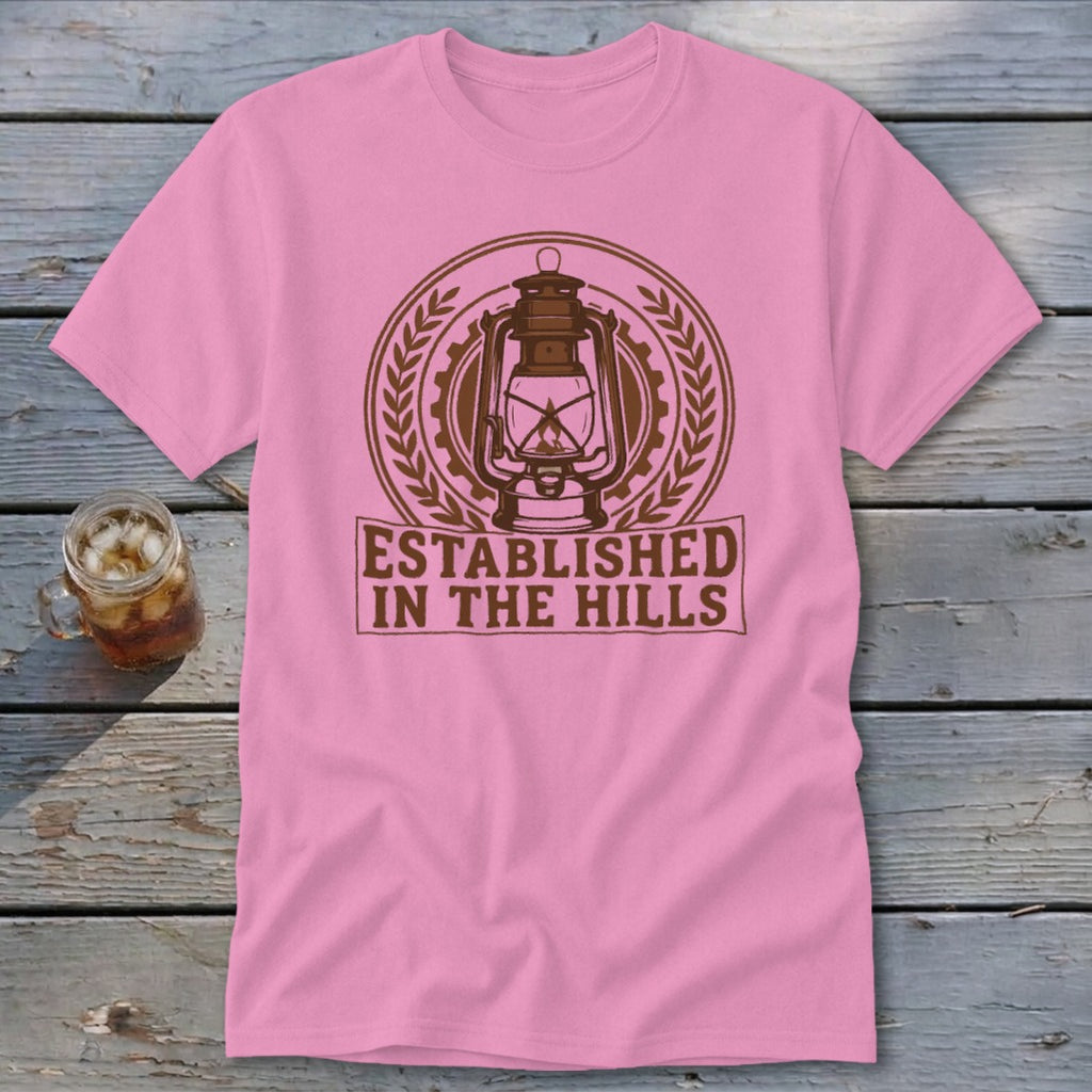 Pink t-shirt with brown lantern graphic and "ESTABLISHED IN THE HILLS" text.