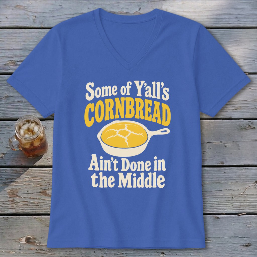 Blue V-neck t-shirt featuring the text "Some of Y'all's Cornbread Ain't Done in the Middle" and a yellow cornbread graphic in a skillet.