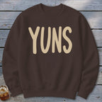 Brown sweatshirt with tan text that says "YUNS".