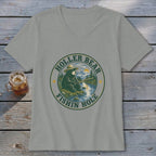 T-shirt with a graphic of a bear fishing by a river and mountains, text "HOLLER BEAR FISHIN HOLE".