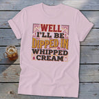 Pink t-shirt with "Well I'll be dipped in whipped cream" text design.