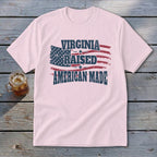 Pink t-shirt with American flag graphic and text: Virginia Raised American Made.