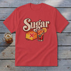 A red short-sleeve t-shirt with retro graphic text reading Sugar above a cornbread square marked with a red X and an iced tea marked with a green checkmark.