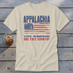 A beige t-shirt with distressed American flag graphics and text reading Appalachia, 13 States, One Free Country.