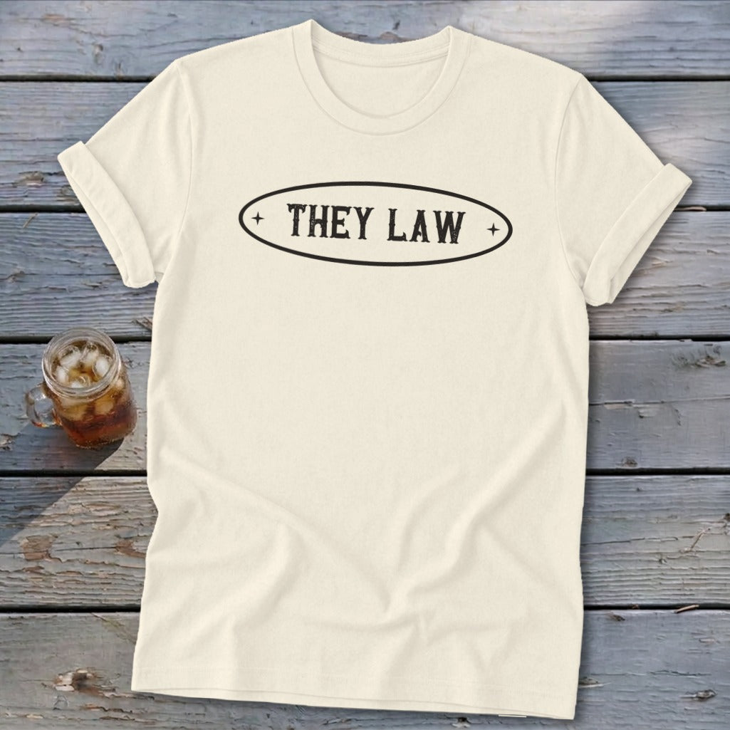 Cream t-shirt with black oval logo reading "THEY LAW".