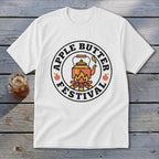 White t-shirt featuring a circular "Apple Butter Festival" logo with a teapot over a campfire.