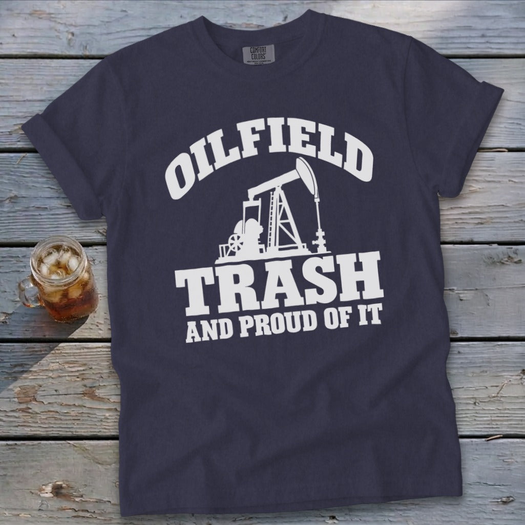 Navy t-shirt with white text and oil rig graphic: OILFIELD TRASH AND PROUD OF IT.