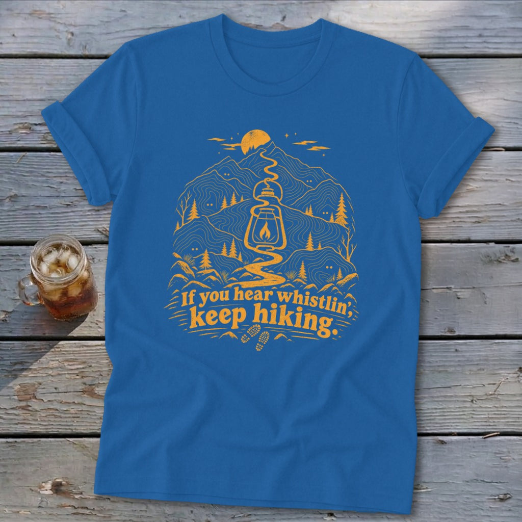 Blue t-shirt with yellow hiking graphic and text "If you hear whistlin', keep hiking."