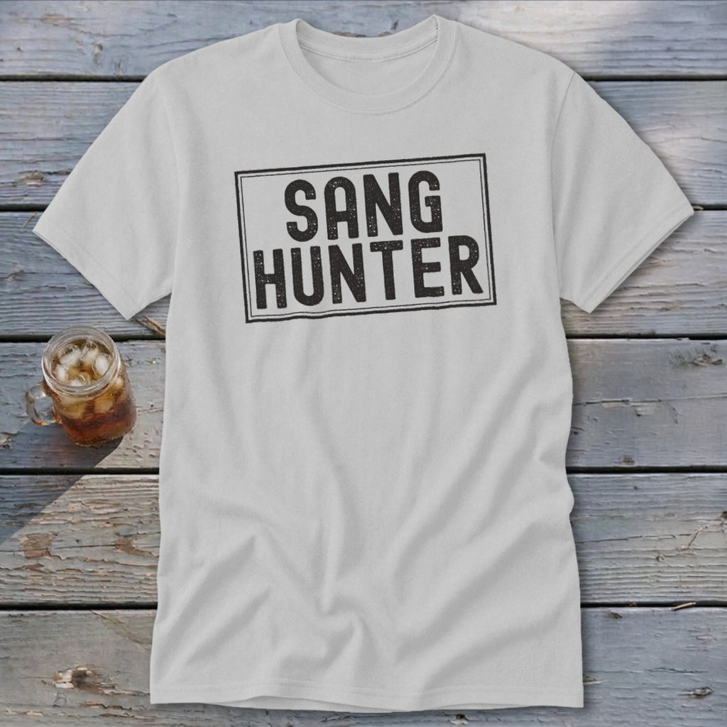White t-shirt with "SANG HUNTER" text in a distressed black rectangle.