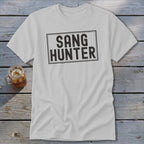 White t-shirt with "SANG HUNTER" text in a distressed black rectangle.