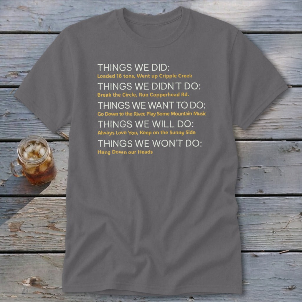 Gray t-shirt with yellow text listing "Things We Did", "Things We Didn't Do", "Things We Want To Do", "Things We Will Do", and "Things We Won't Do".