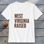 White v-neck t-shirt with brown text that reads "WEST VIRGINIA RAISED".