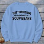 Light blue crewneck sweatshirt with black text reading This Thanksgiving is Sponsored by Soup Beans.