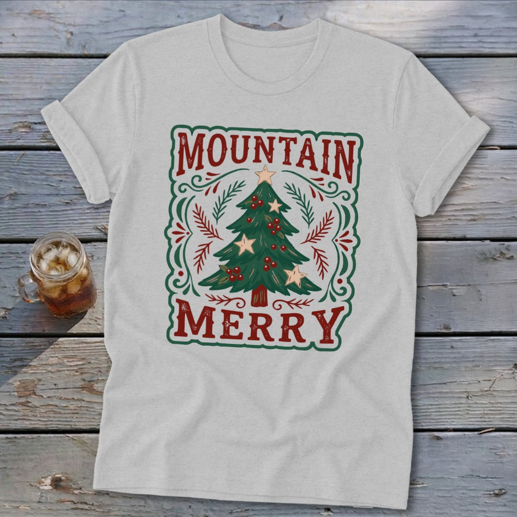 A light gray t-shirt with a vintage Christmas tree design and the text Mountain Merry.