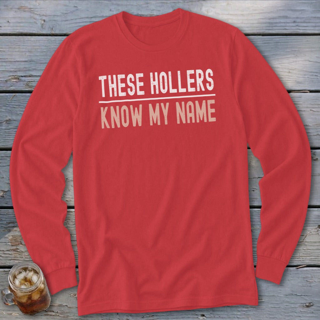 Red long-sleeved shirt with "THESE HOLLERS KNOW MY NAME" text.