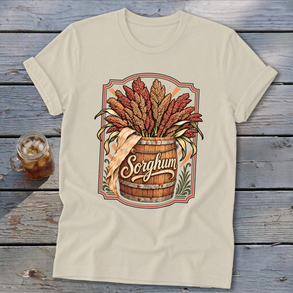 T-shirt with a wooden barrel overflowing with sorghum and the word "Sorghum"