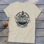 Cream t-shirt with "Appalachian Born and Bred Still Standing" text and lantern graphic.