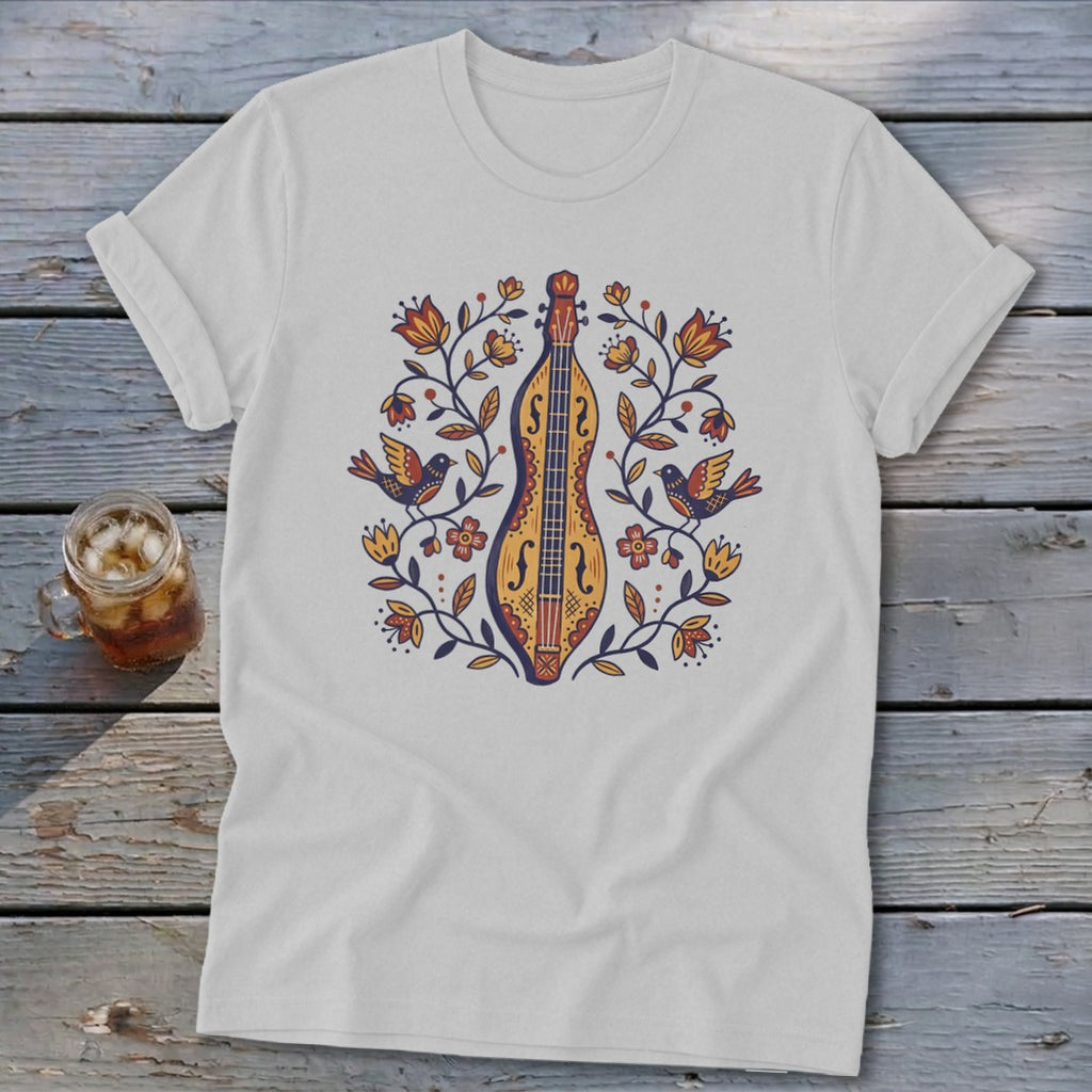 White t-shirt with a colorful folk art print of a dulcimer and birds.