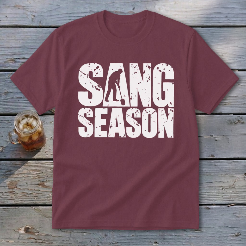 Maroon t-shirt featuring white distressed text reading "SANG SEASON" with a silhouette of a person digging.