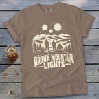 Brown short-sleeve t-shirt featuring a mountain graphic and the text Brown Mountain Lights.