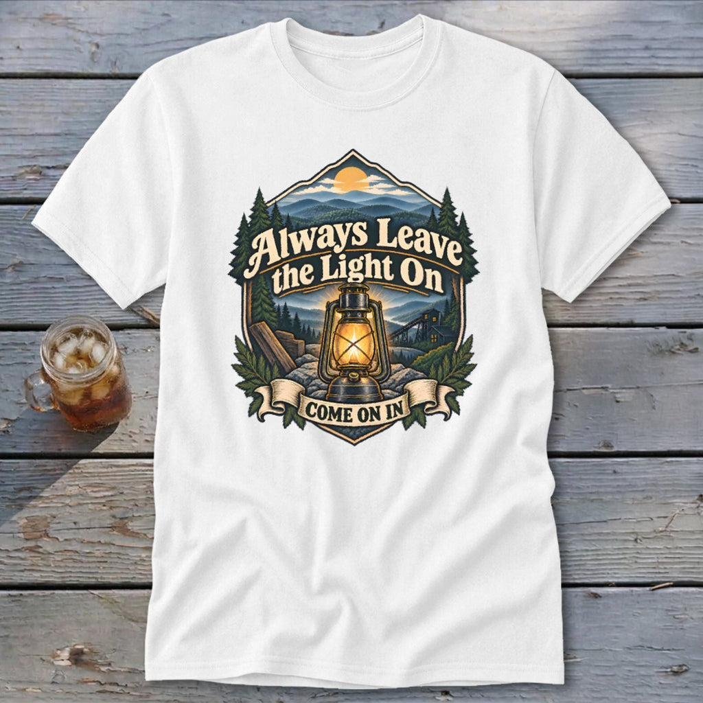 White t-shirt with vintage outdoor scene, lantern, and text "Always Leave the Light On Come On In".