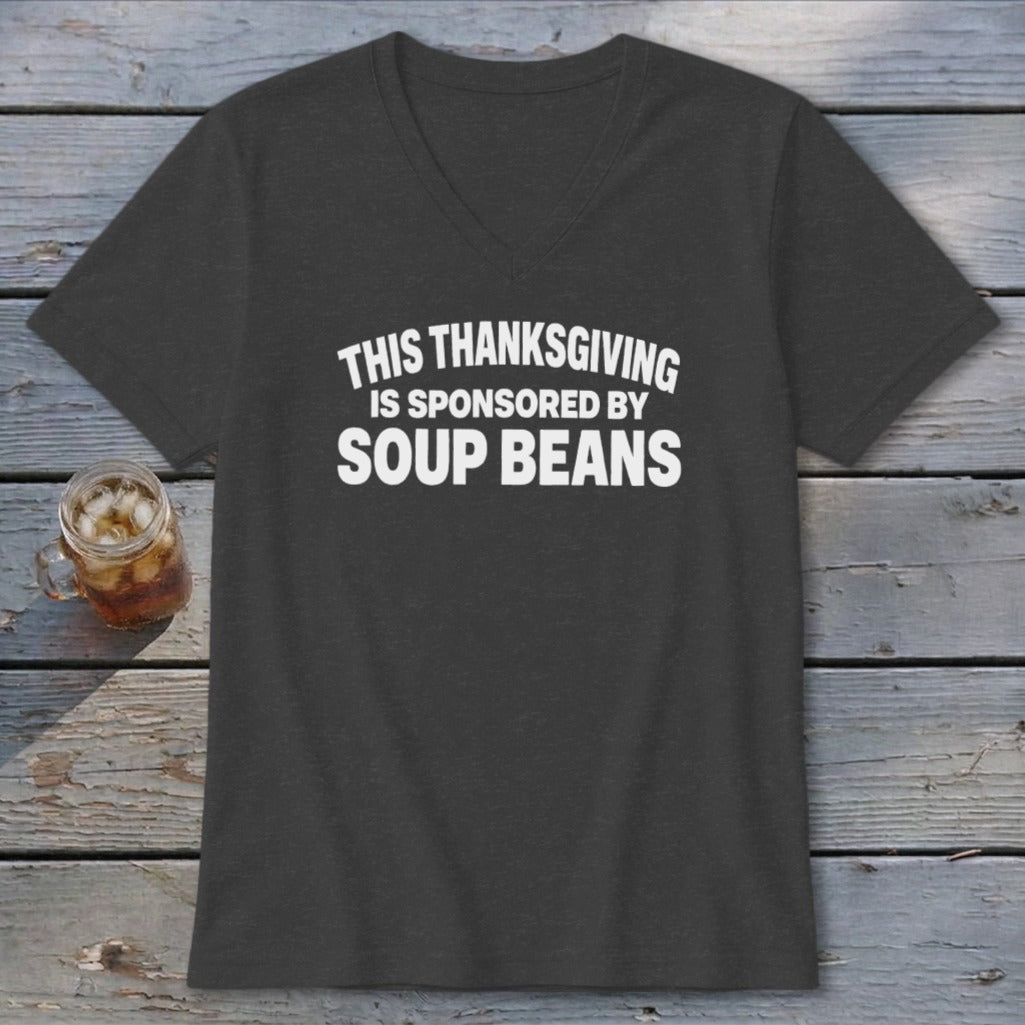 A dark gray V-neck t-shirt with white text reading THIS THANKSGIVING IS SPONSORED BY SOUP BEANS.
