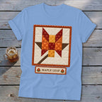 Light blue t-shirt with a square maple leaf quilt block design and "Maple Leaf" text.