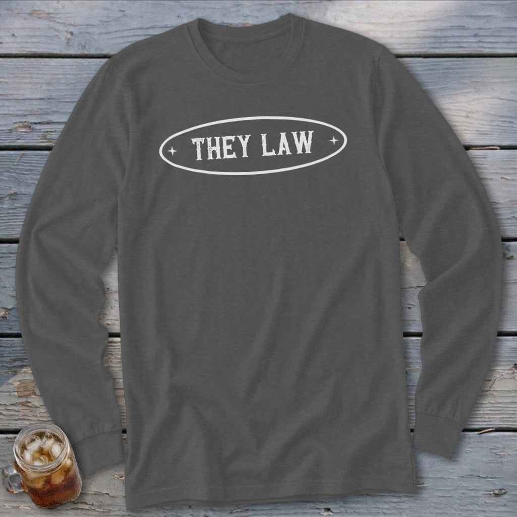 Long-sleeve charcoal gray t-shirt with white oval logo and text "THEY LAW".