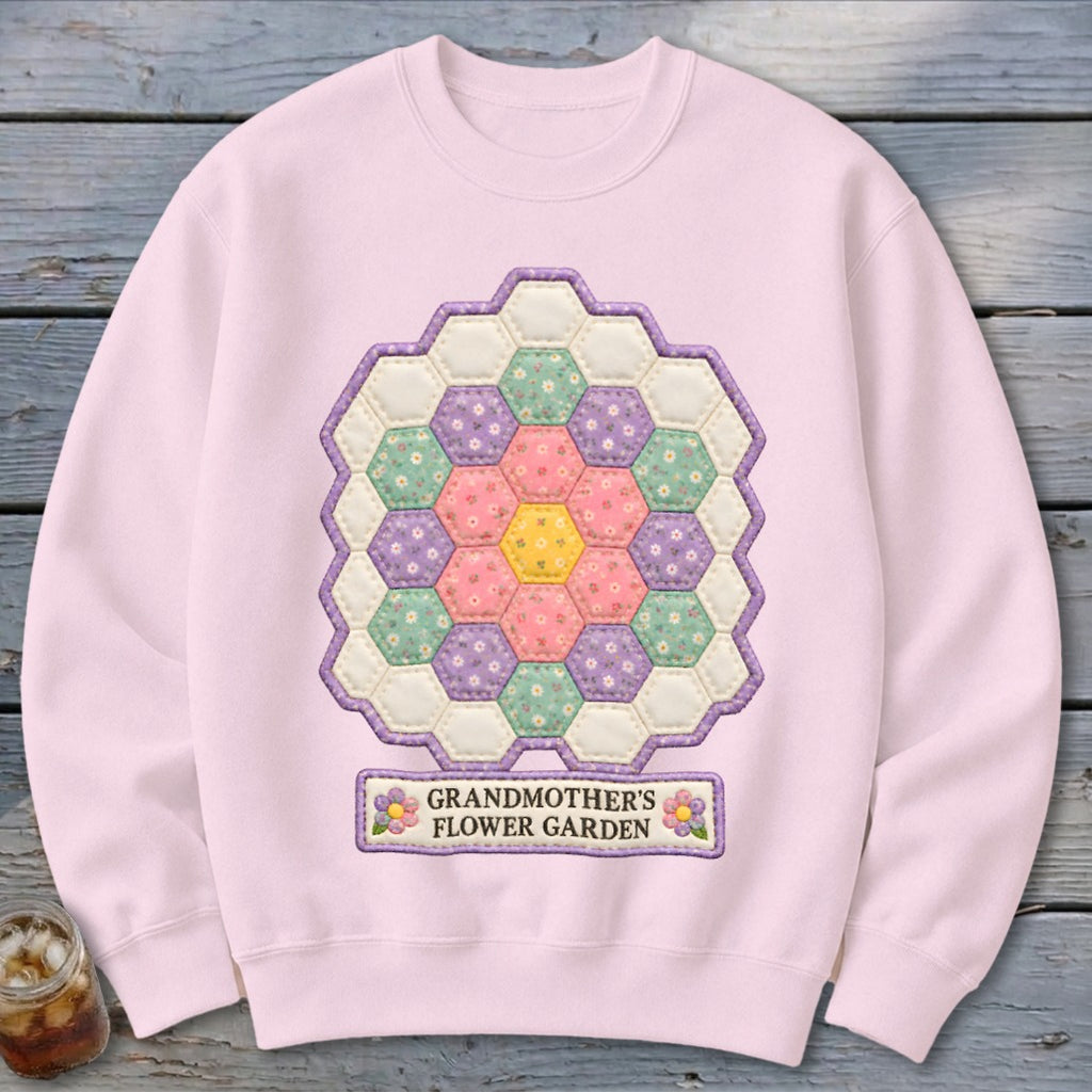Pink sweatshirt with hexagonal patchwork flower design and "Grandmother's Flower Garden" text.