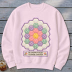 Pink sweatshirt with hexagonal patchwork flower design and "Grandmother's Flower Garden" text.