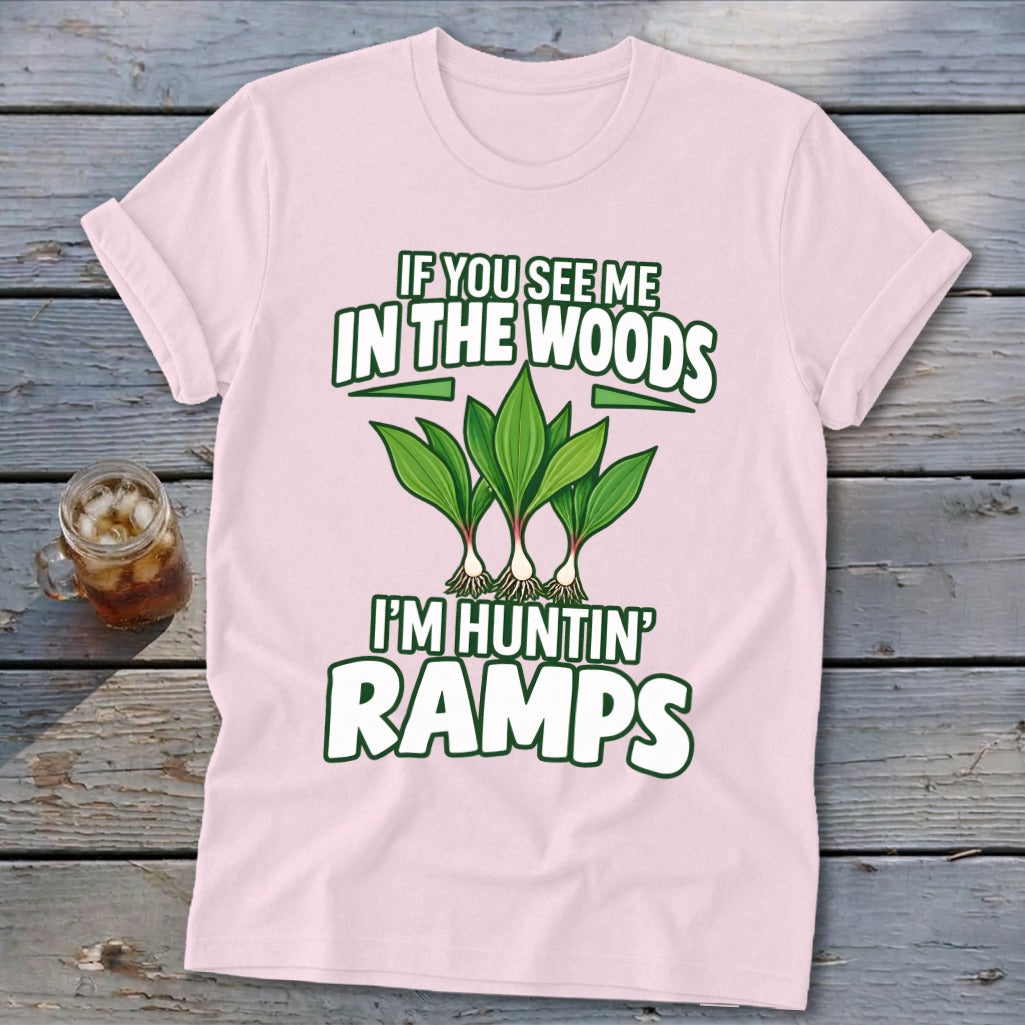 Light pink short-sleeve t-shirt with green text reading If You See Me In The Woods Im Huntin Ramps and an illustration of ramps.