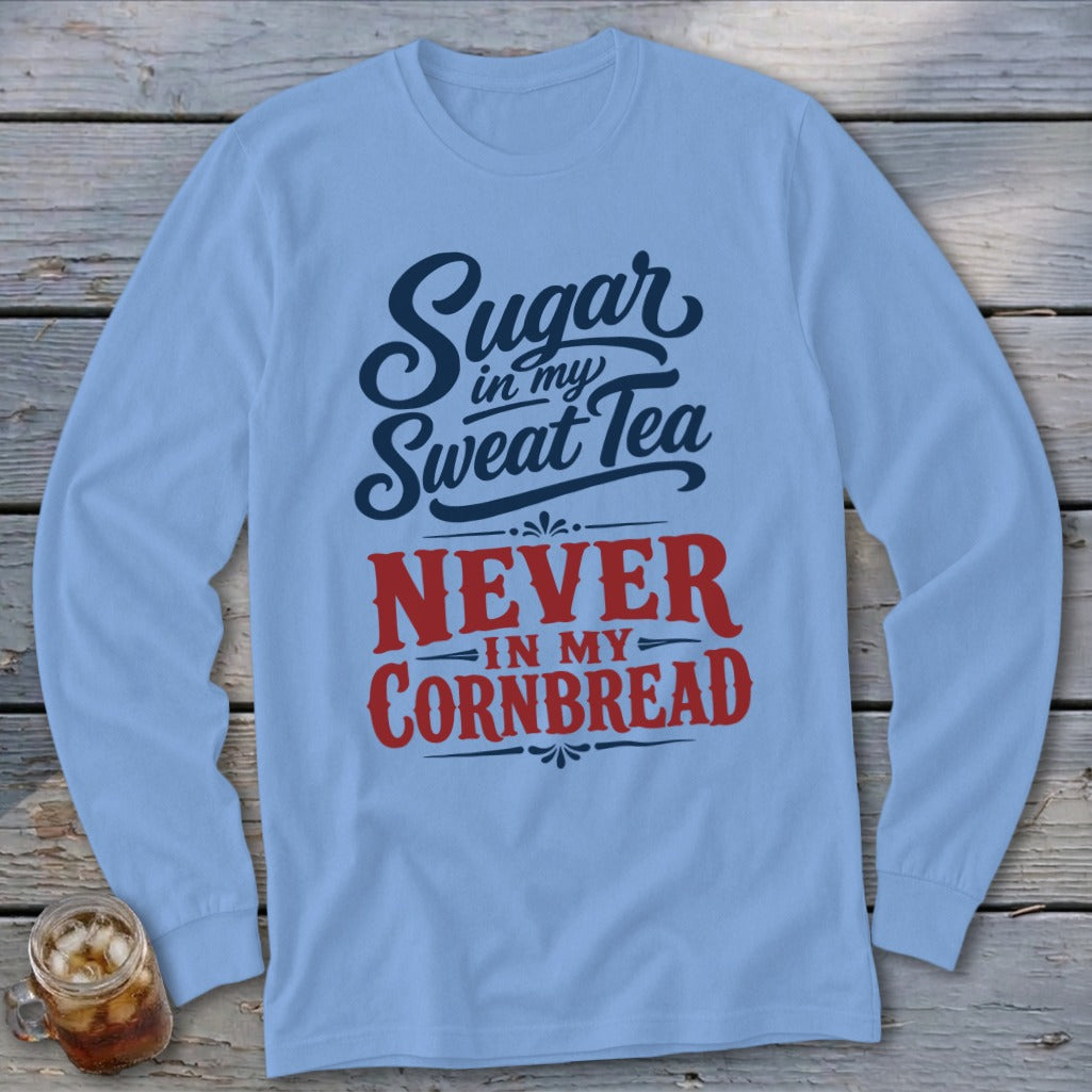Light blue long-sleeved shirt with blue and red text that reads Sugar in my Sweat Tea, NEVER IN MY CORNBREAD.