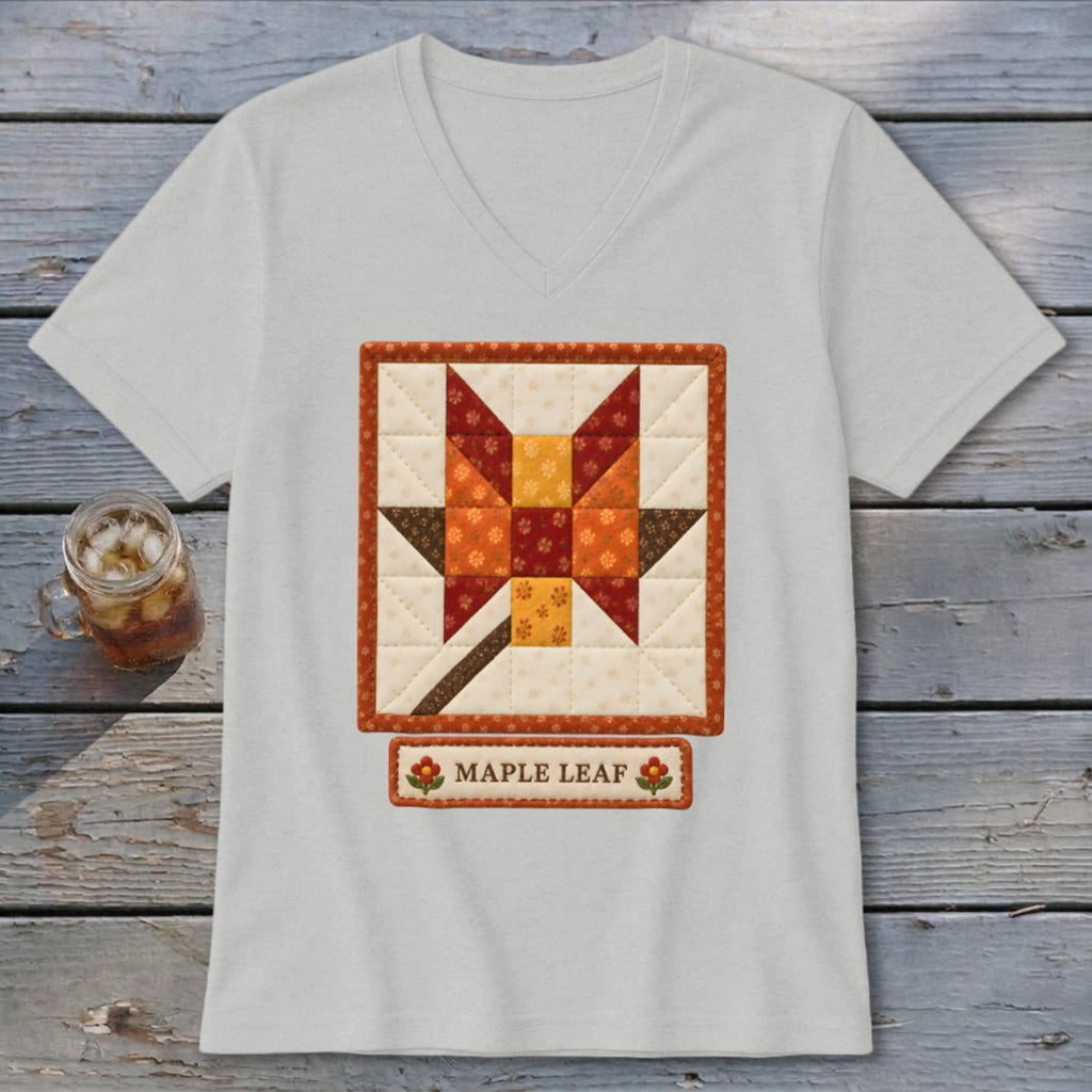Light grey v-neck t-shirt with quilted maple leaf design and "MAPLE LEAF" text.