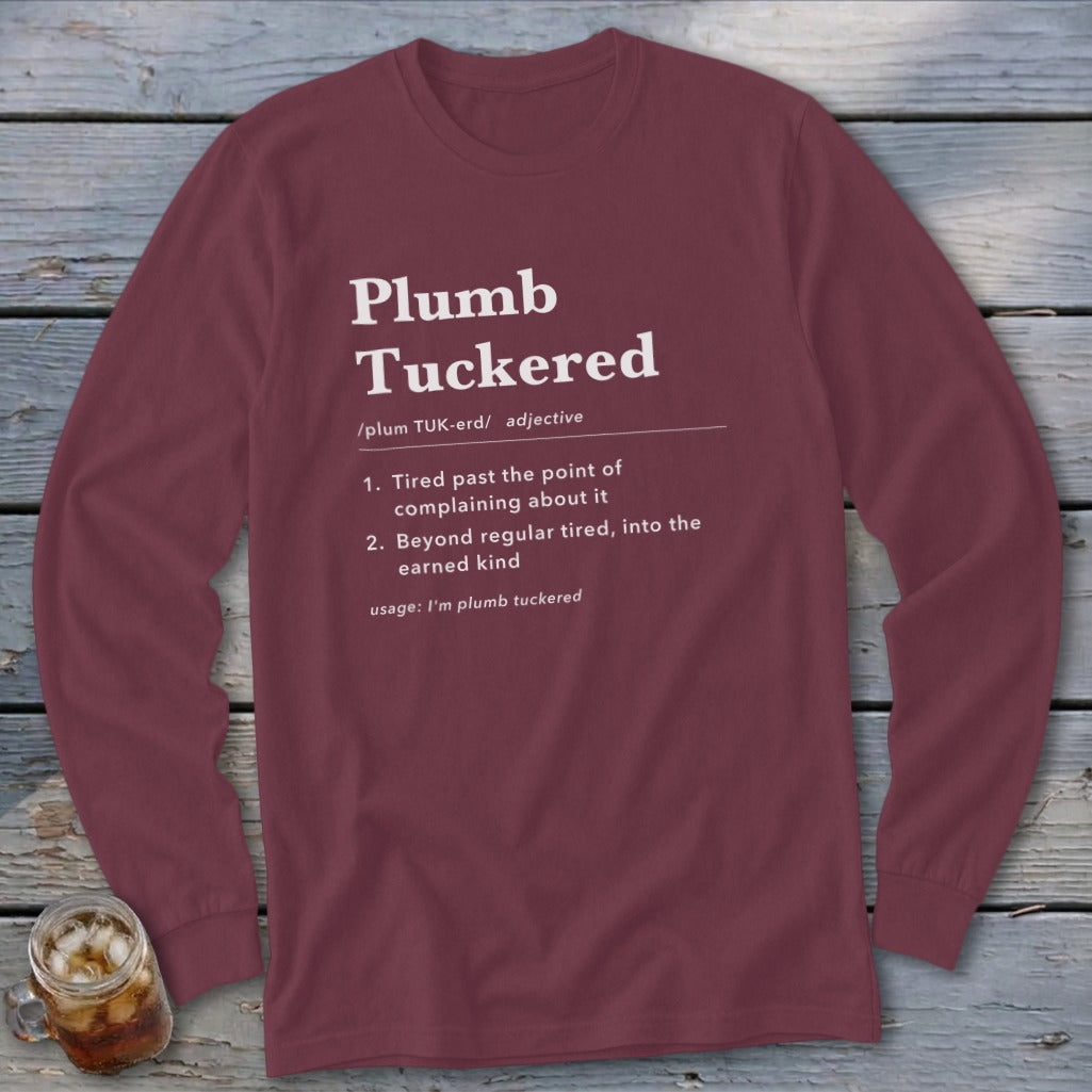 Maroon long sleeve shirt with "Plumb Tuckered" definition printed in white.