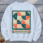 White sweatshirt with a quilt-style graphic of "Drunkard's Path" pattern.