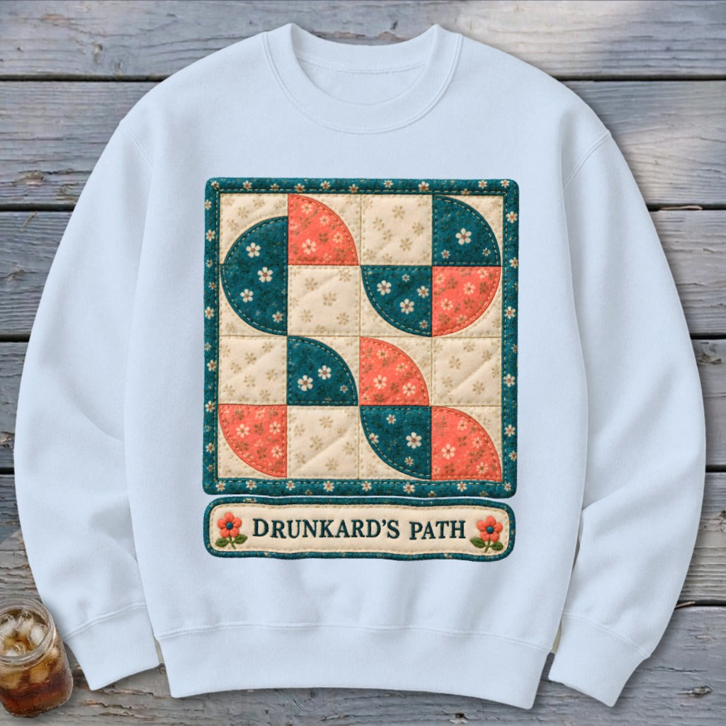 White sweatshirt with a quilt-style graphic of "Drunkard's Path" pattern.
