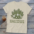 Cream t-shirt with a graphic of morel mushrooms and text "WILD FORAGED APPALACHIA".