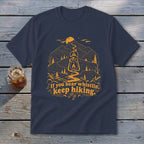 Navy t-shirt with orange mountain landscape, lantern, and text: "If you hear whistlin', keep hiking."