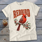 Off-white t-shirt with a vintage red cardinal graphic and the word REDBIRD above it.