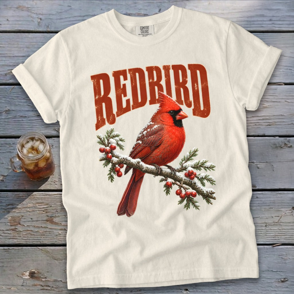 Off-white t-shirt with a vintage red cardinal graphic and the word REDBIRD above it.