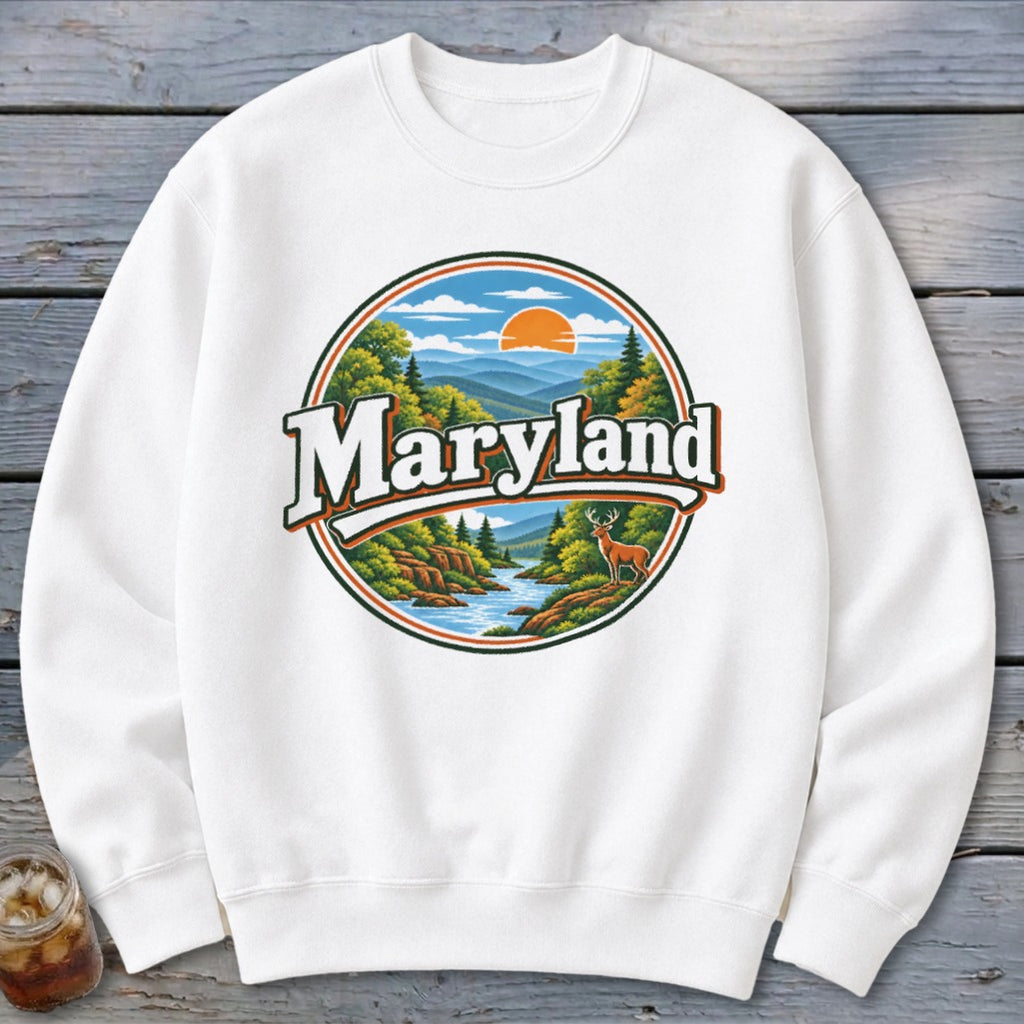 White sweatshirt with round Maryland graphic featuring deer and mountain landscape.